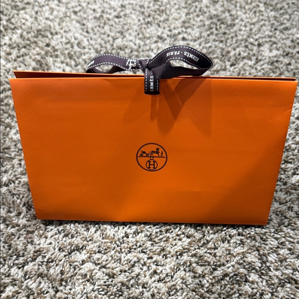 Hermès Vibrant Orange Bag with Black Ribbon